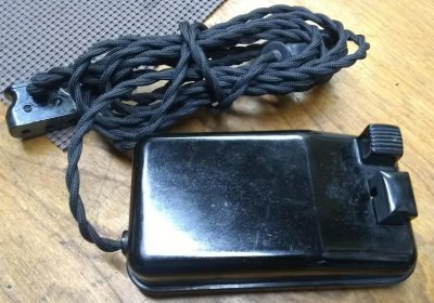 An old cloth covered foot pedal and wiring being replaced